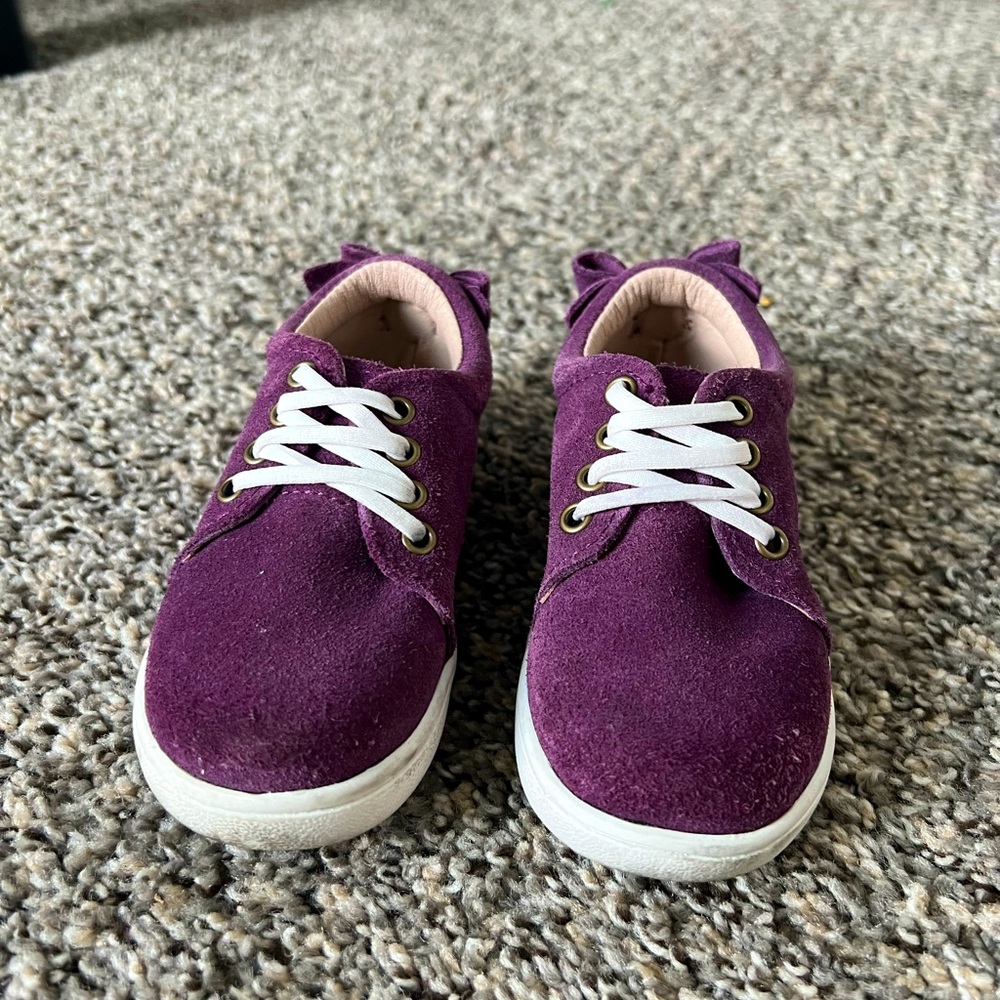 Monkey feet purple suede bow back slip ons.